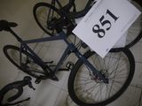 a bicycle that is sitting on the floor with a price tag attached to it