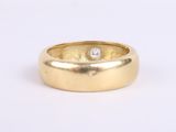 an image of a gold ring with a diamond in the center