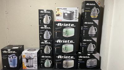 many boxes of coffee on a shelf in a room