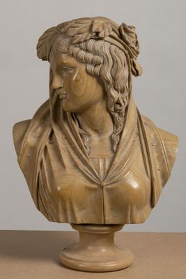 bust of a woman with braids on her head