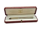 a close up of a pen in a case on a white surface