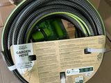 boxes of garden hoses are stacked on top of each other