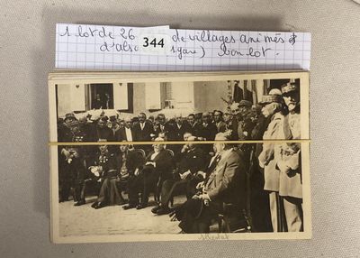 an old photo of a group of men standing in front of a building