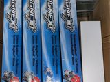 four boxes of toothpaste sitting in a cardboard box on top of a table