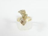 a gold ring with a diamond snake on top of it