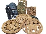 a lot of wood carvings that are on the table