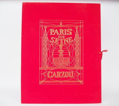 an old book with a red cover and gold lettering on it
