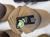 several pairs of shoes and a hat with a tag on them