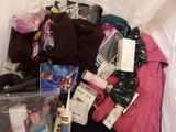 a pile of clothing and other items in a plastic bag