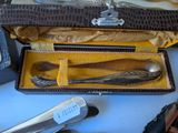 a box with a knife, spoon, and other items in it