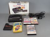a nintendo game system and several other games on the table
