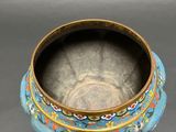 a close up of a bowl on a table with a black background