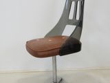 an image of a chair with a leather seat on a metal stand