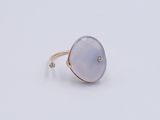 a close up of a ring on a white surface