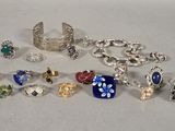 a lot of different rings and bracelets on the table