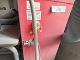 a machine that has a hose attached to the side of it