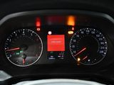 a close up of a car dashboard with a speedometer and gauges