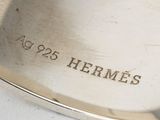 a close up of a silver plate with writing on it