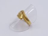 an image of a gold plated ring with a clear glass