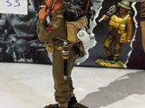 figurine of a soldier with a gas mask and a gas mask on his head