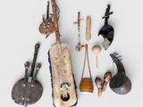 many different types of musical instruments displayed on a white surface