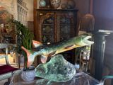 a statue of a fish on a table in a living room