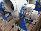 three blue and white blowers on a pallet in a warehouse