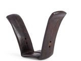 the small wooden object is sitting on a white surface
