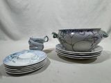 many plates and bowls that are sitting on a table