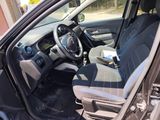 the interior of a car with the door open and the driver ' s seat down