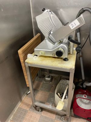 a machine that is sitting on a cart in a kitchen