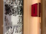 many glasses on the shelves in the room