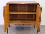 an image of a wooden cabinet with open doors