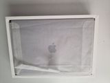 a picture of an apple product in a white box