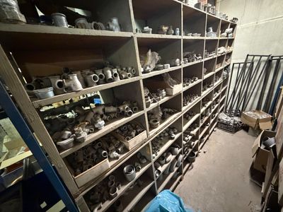 a room with a lot of shelves filled with various items