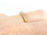 a close up of a person ' s hand with a ring on it