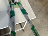 a pair of pliers sitting on a table next to a bottle of water