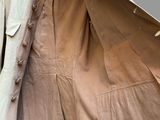 an image of a jacket and pants hanging on a hanger