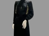 an image of a mannequin wearing a black dress and hat