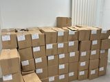 a large pile of boxes sitting on the floor in a room