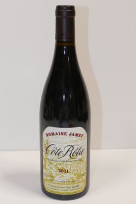a bottle of wine that is sitting on a table