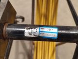 a close up of a metal pipe with a sticker on it