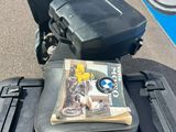 a motorcycle that has a book on the back of it