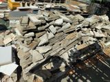 a pile of rubble on the ground next to a construction site