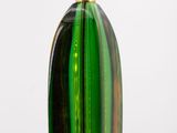 a green glass vase with a gold top on a table
