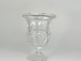 a glass vase that is sitting on a table
