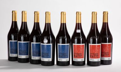 six bottles of wine are lined up in a row