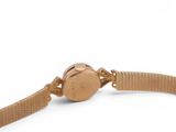 an image of a gold wrist watch with a chain around it