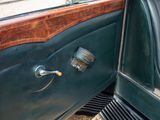 a close up of a car door handle and the door handle is open
