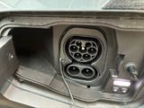 a picture of a car that has a plugged in the trunk